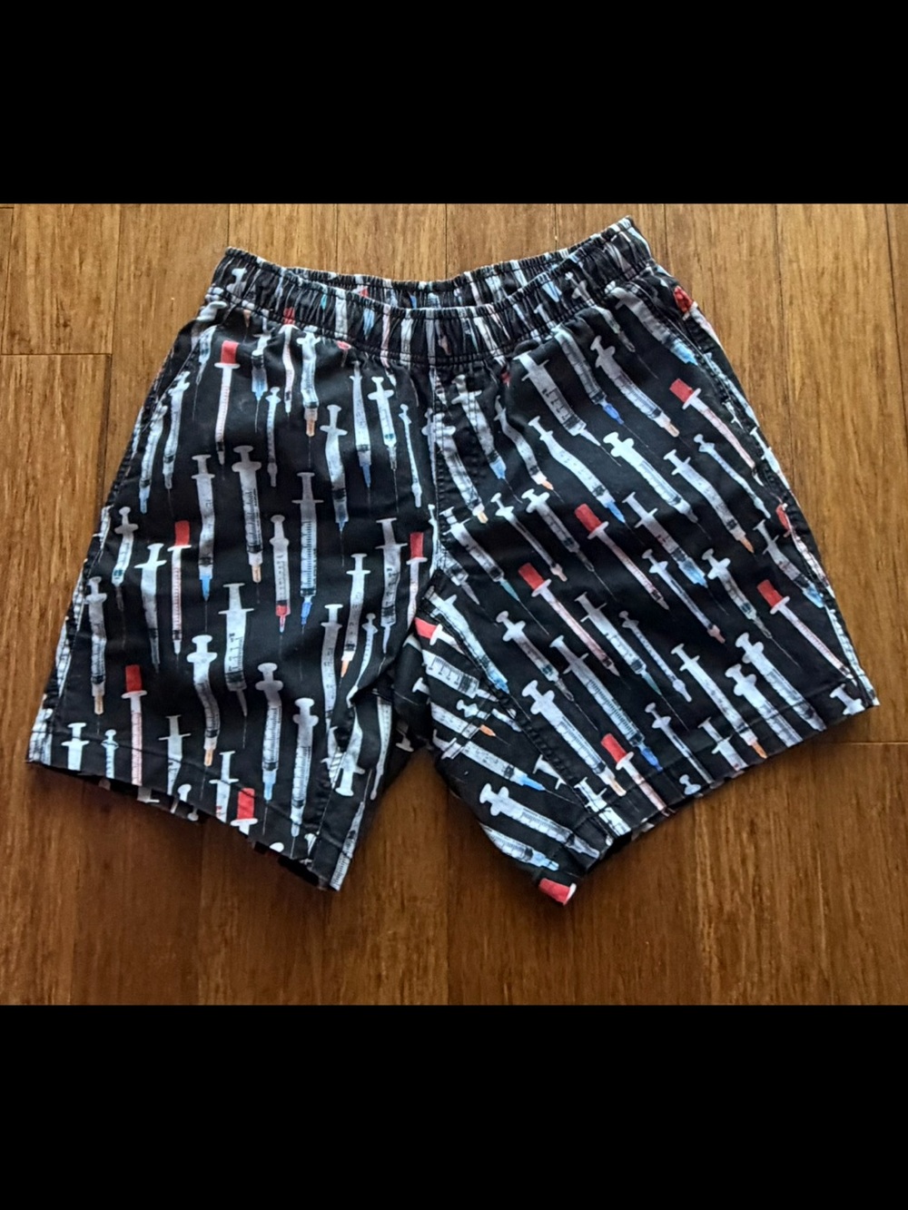 Black Swim Shorts with White and Red Syringe Print